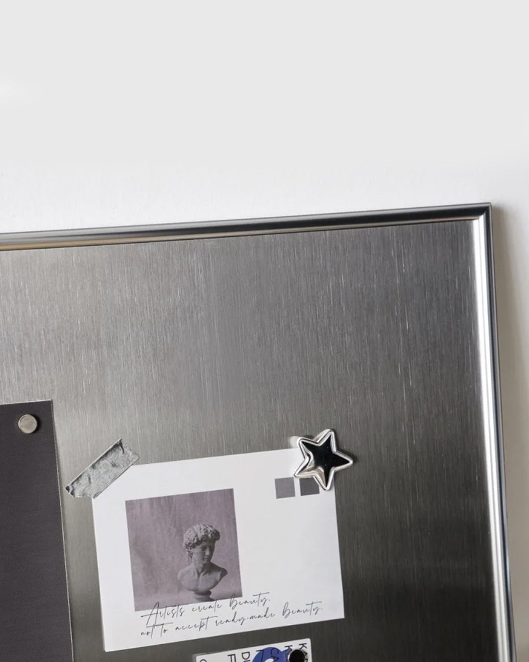 Magnetic display board mounted in a living room