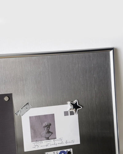 Magnetic display board mounted in a living room