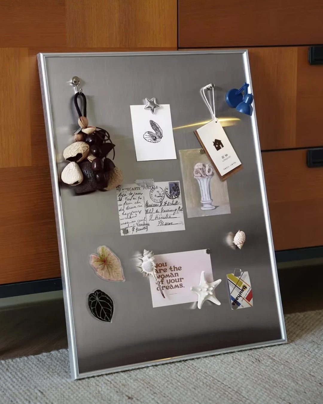 Display board styled in an entryway gallery wall