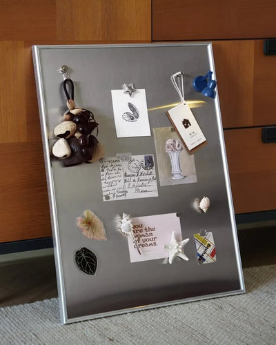 Display board styled in an entryway gallery wall