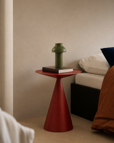 metal side table shown styled beside a sofa