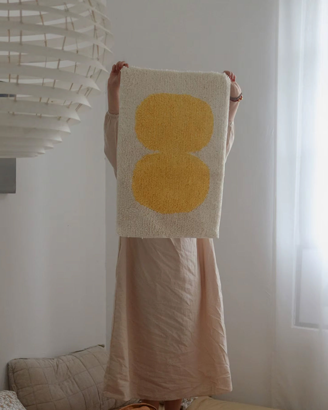 oval tufted bath mat shown styled in a modern bathroom setting