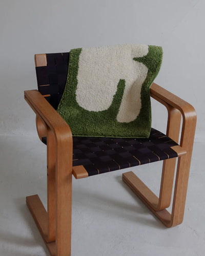 elephant shape nursery rug shown styled in a kids bedroom setting