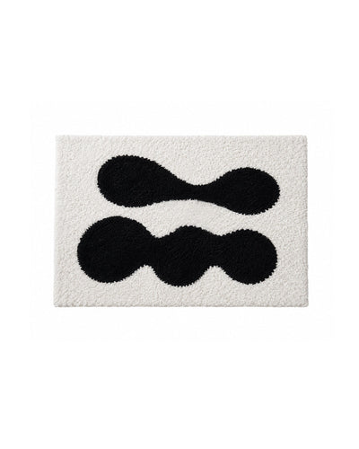 Abstract black and white tufted doormat, full top-down view