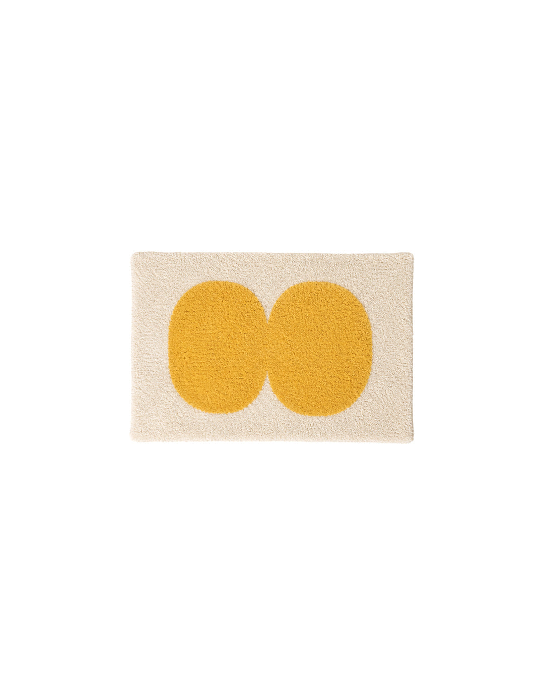 oval tufted bath mat with mustard yellow double-circle design - front view product photo