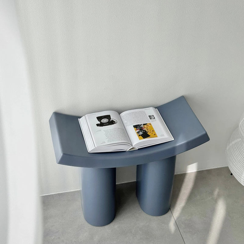 Modrn Color Accent ABS Stool shown in natural light on a wooden table