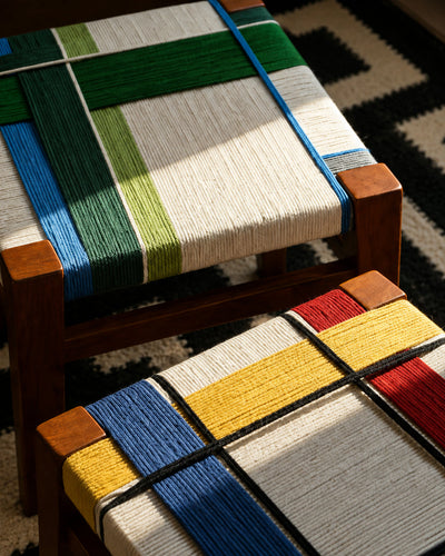 woven cord stool shown styled as a bedside plant stand