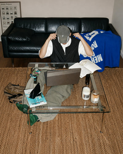 Side profile of glass coffee table showing slim leg frame