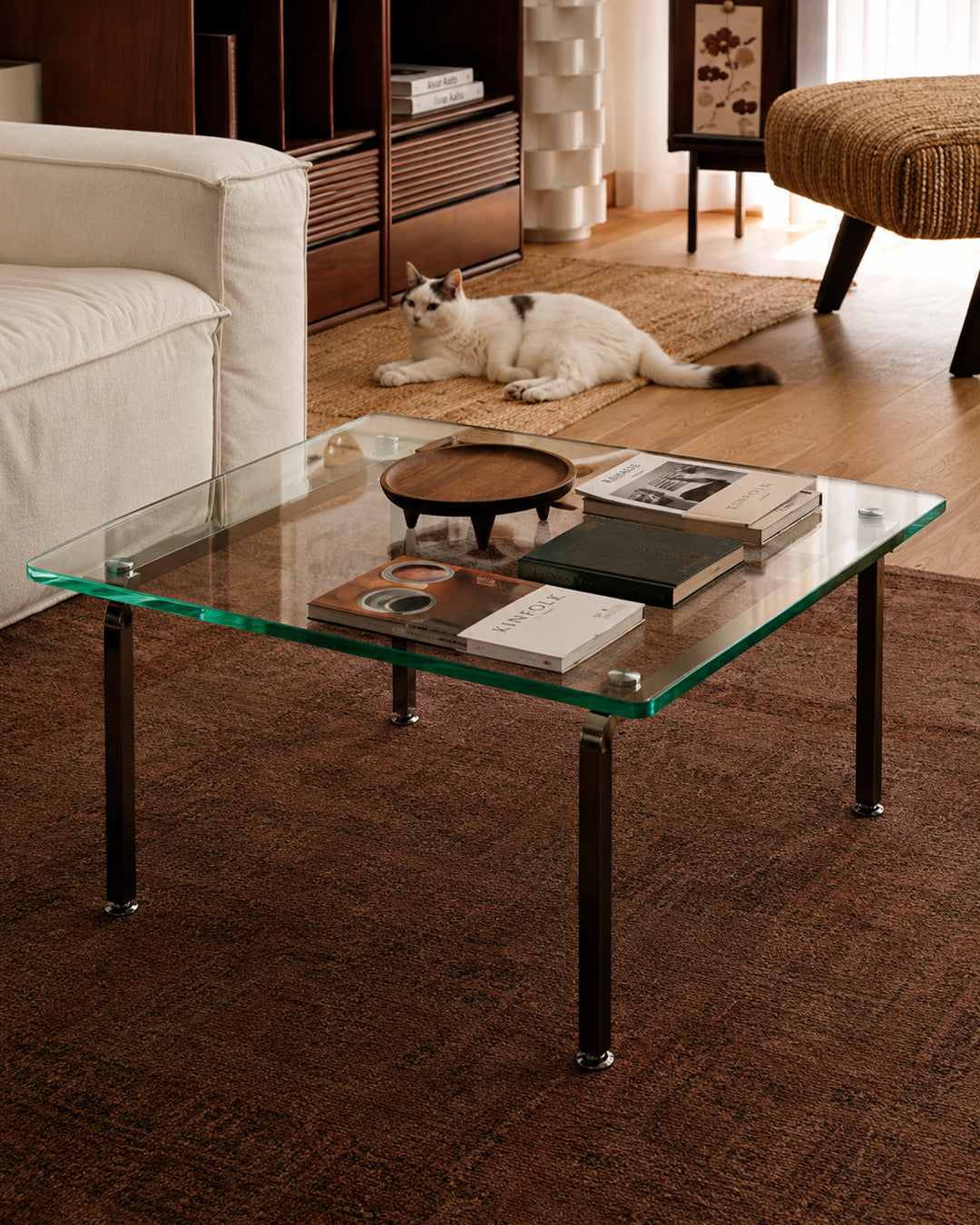 Glass coffee table paired with a sofa in a lounge setting
