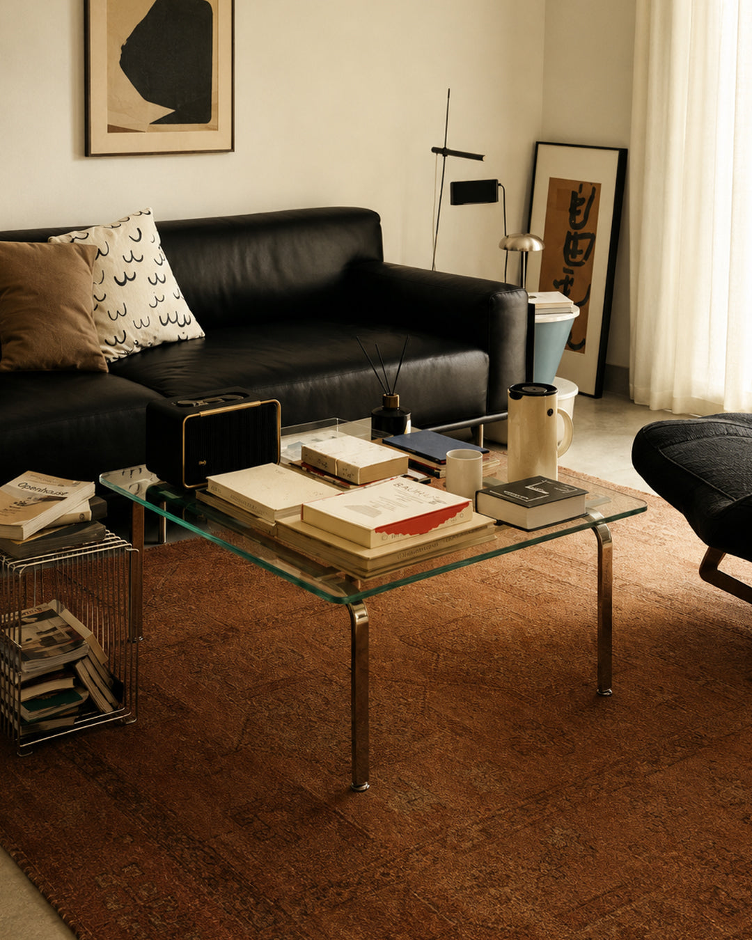 Glass coffee table styled in a living room setting
