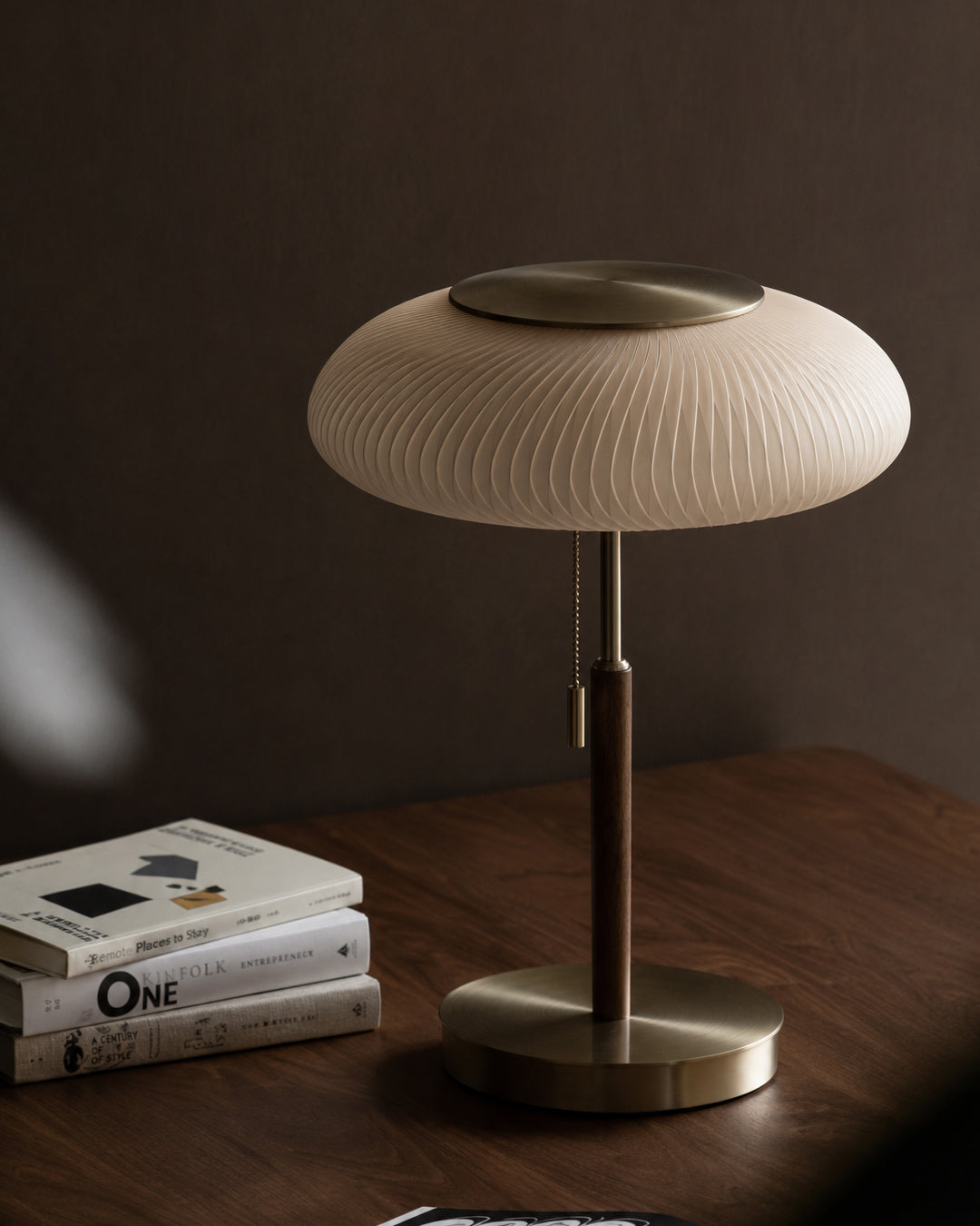 Close-up of walnut and brass stem on table lamp