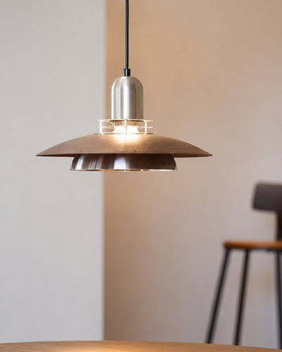 Pendant light illuminated, showing focused downward glow