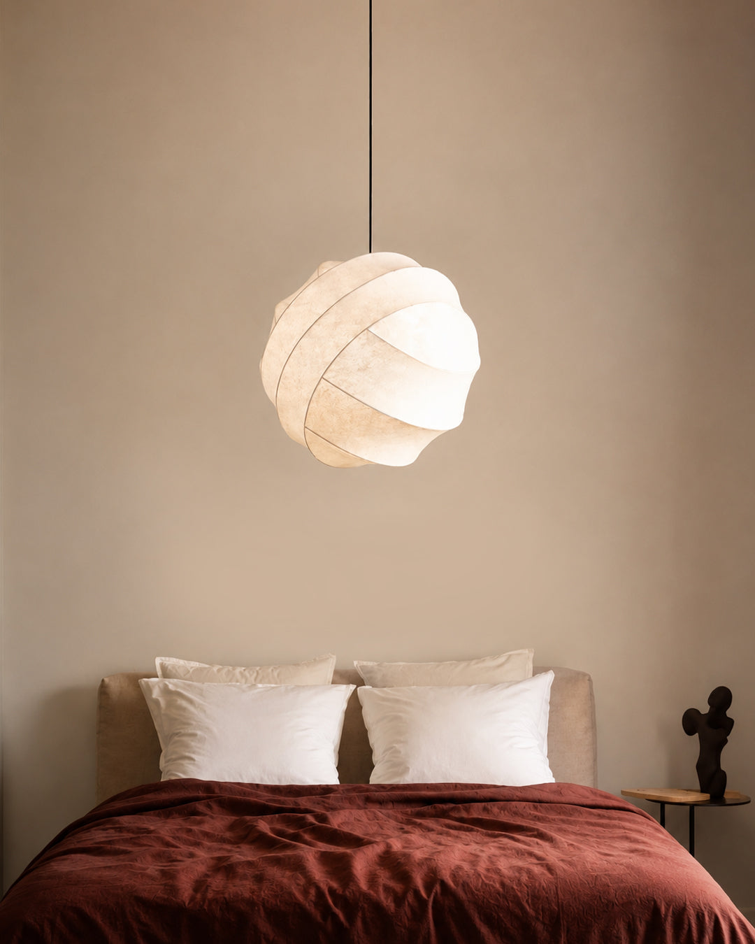 Silk globe pendant light styled in a living room
