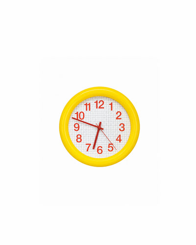bold grid wall clock with thick round frame in yellow - front view product photo